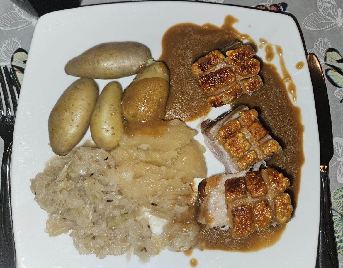 Juleribbe... slow-roasted (Christmas) ribs with potatoes, sauerkraut, mashed apples, and sauce using liquid from the ribs...