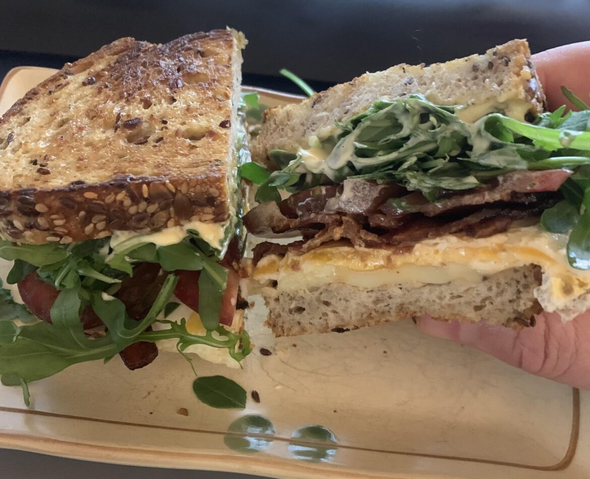 This breakfast sandwich is hard to B.E.A.T! (bacon, egg, arugula, tomato)