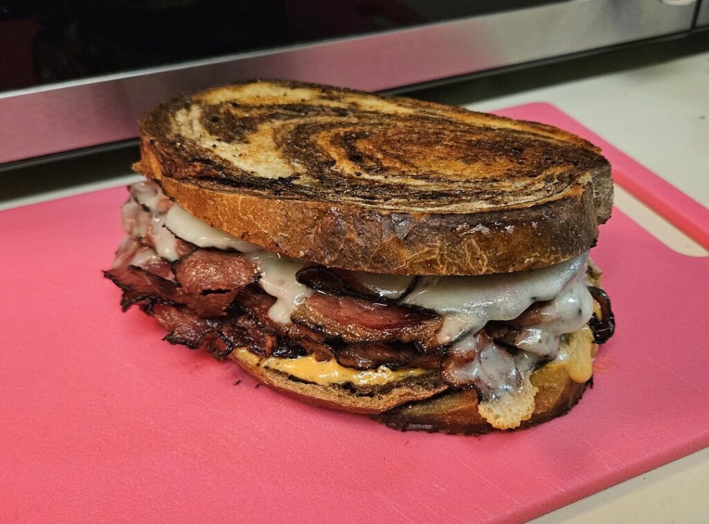 Pastrami, swiss and thousand island on marble rye.
