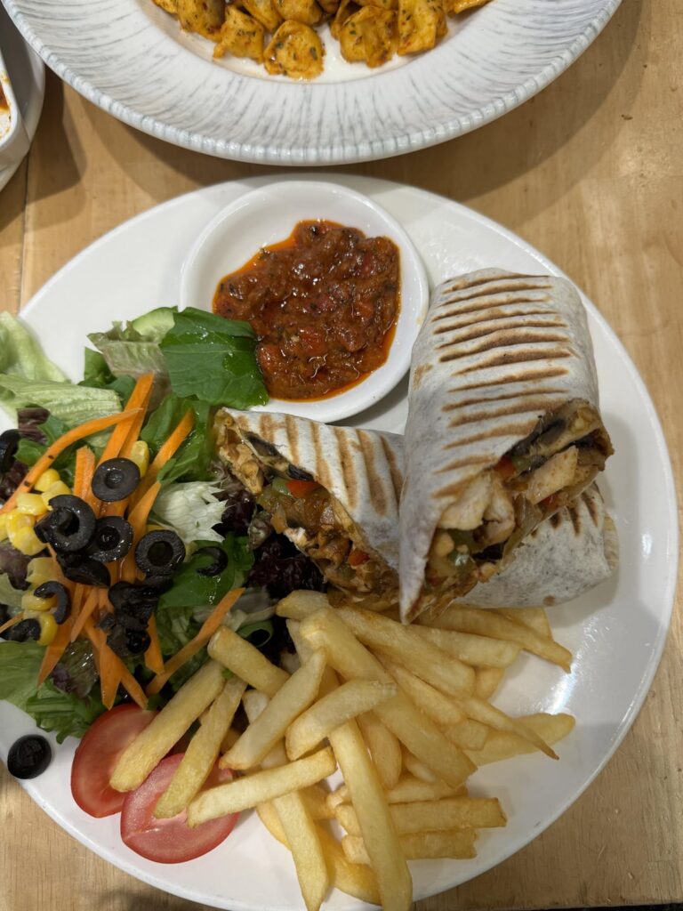 chicken wrap calories? with grilled chicken breast, sautéed mushrooms, peppers, and onion (excluding the sides)