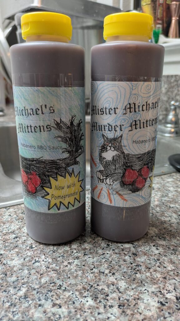 Every year for Christmas, I make a huge batch of BBQ sauce for gifts, and my wife makes the labels. This year's is called Mister Michael's Murder Mittens