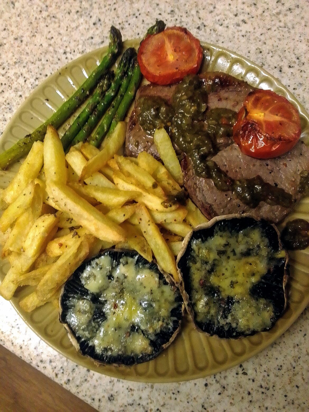 Steak, chimichurri. mushrooms with stilton cheese. Asparagus and tomatoes, chips.