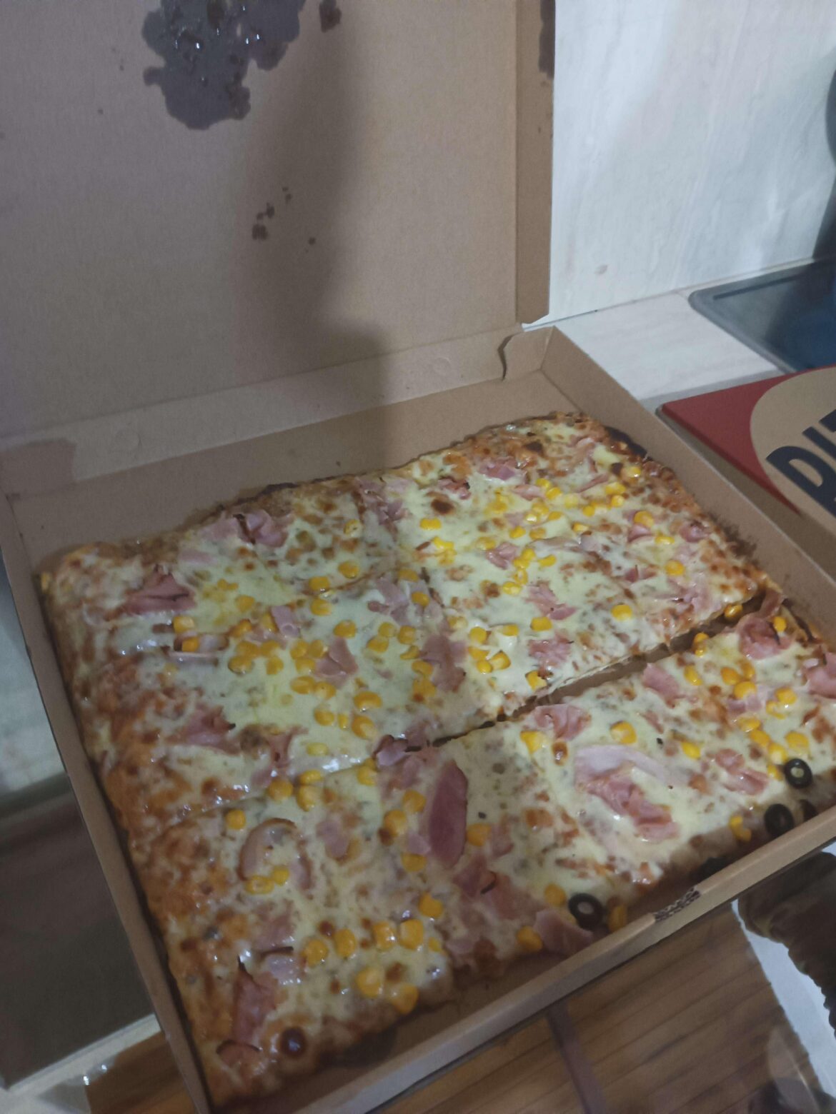 This is my friend's favorite pizza. Its a ham, corn and olive pizza