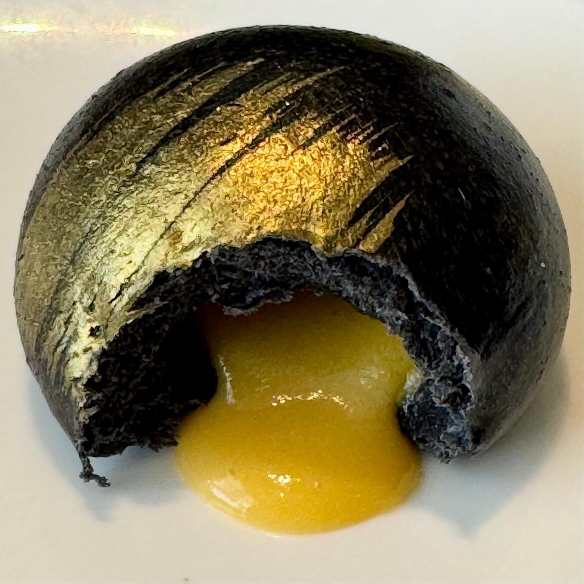 Charcoal bun with egg custard lava filling