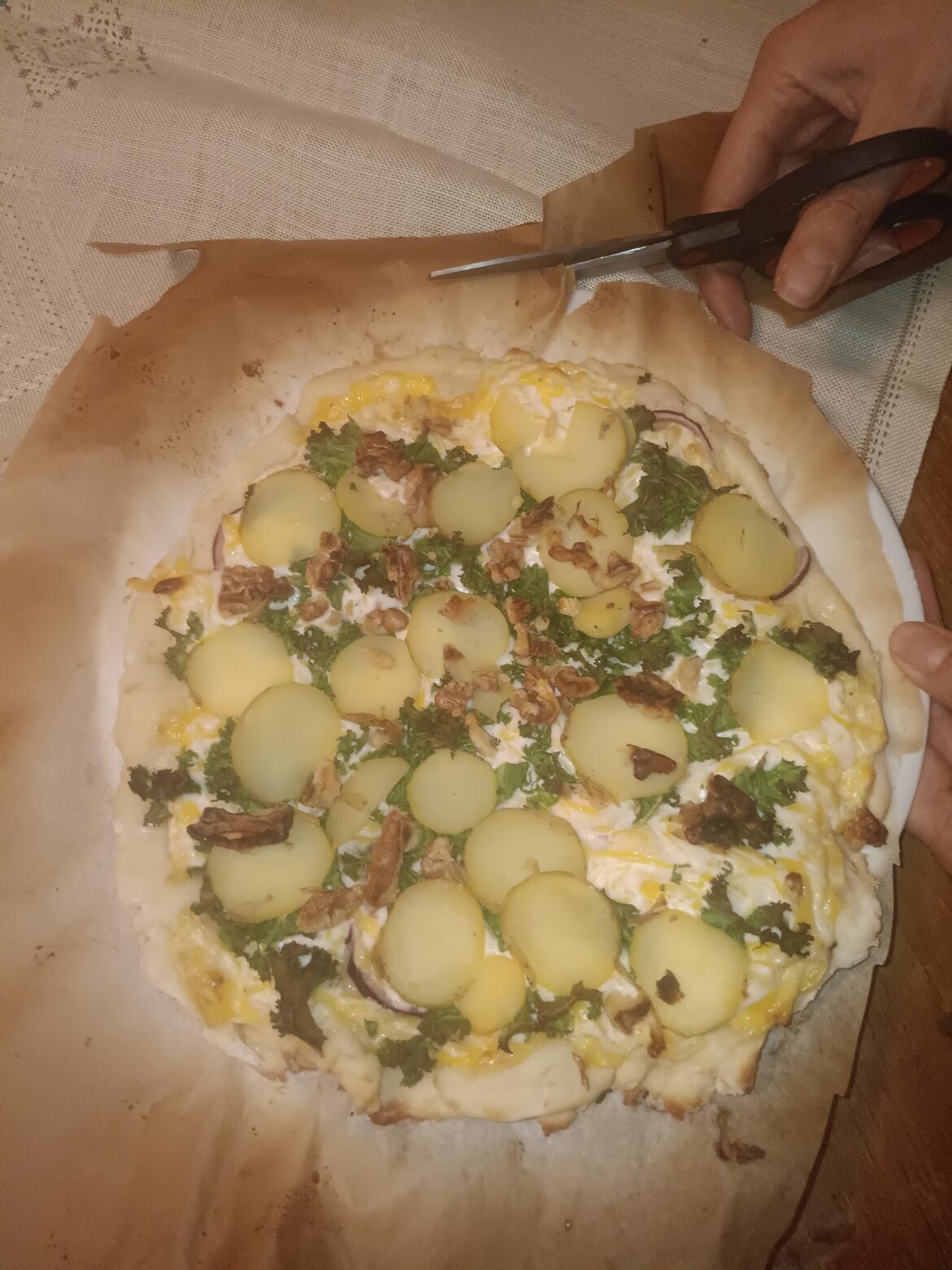 My Swedish roommates' homemade pizza. Vegan gluten-free crush, a mixture of vegan cheese + vegan creme fraiche + garlic powder, red onions, walnuts, kale, and boiled potatoes. They claim this is typical here.