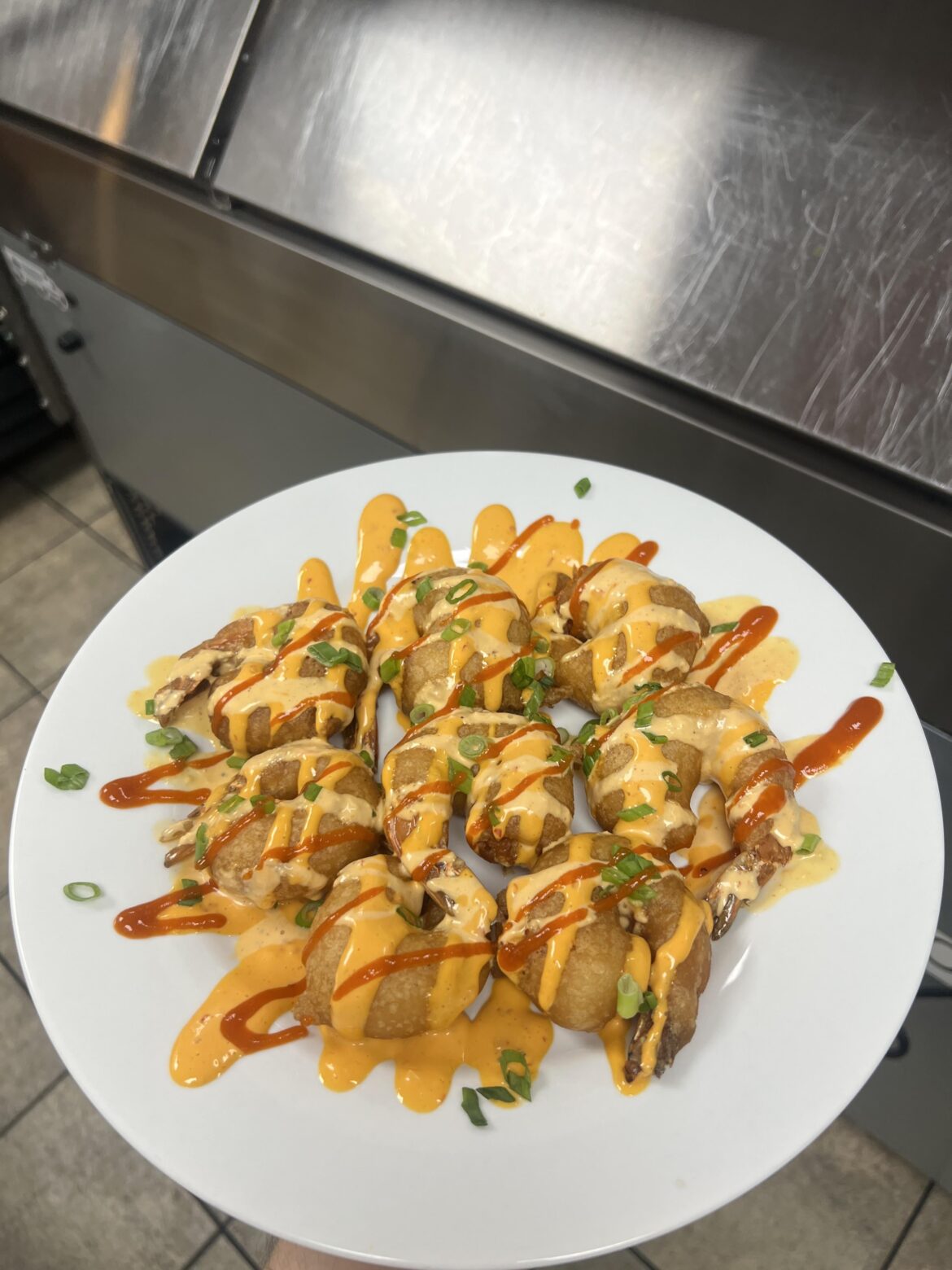 Firecracker Shrimp-beer battered shrimp, boom boom & Sriracha sauce.