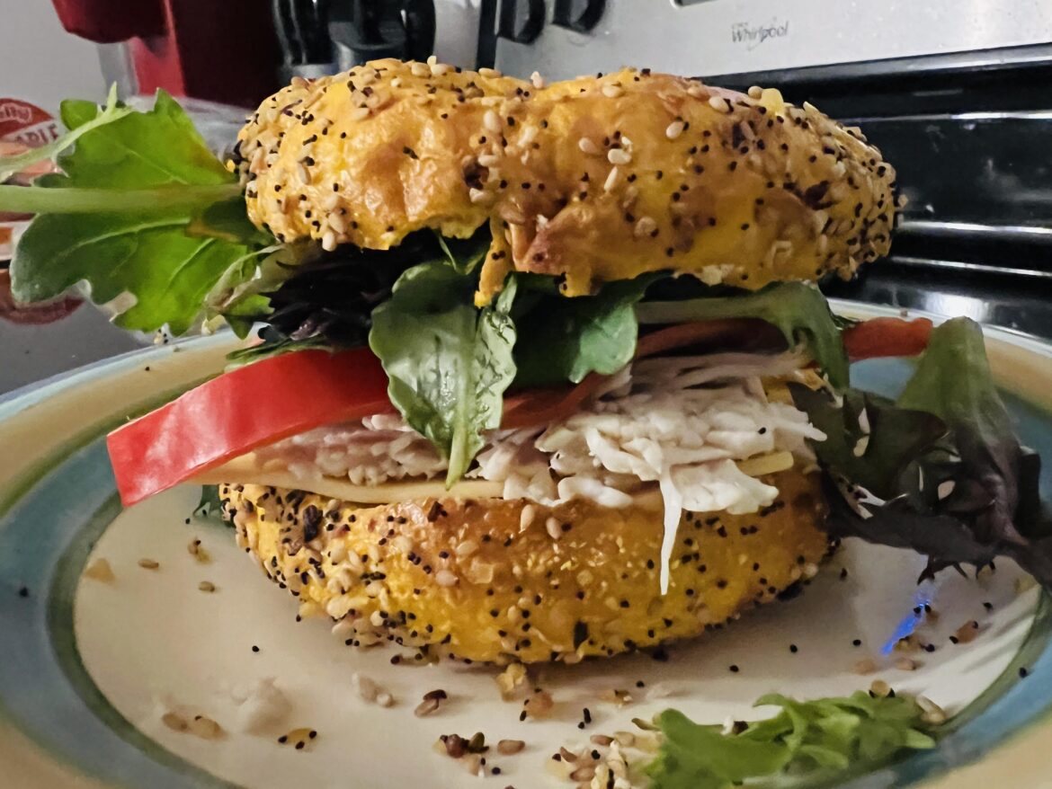 Made this monstrosity for dinner! Gouda, turkey, turkey pepperoni, red pepper, mixed greens, and spicy mayo on an everything egg bagel!