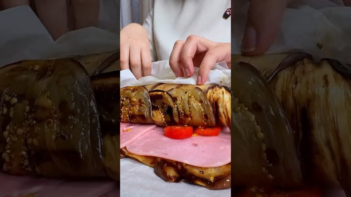 Fantastic baked eggplant roll with cheese and ham. Super delicious and easy dish