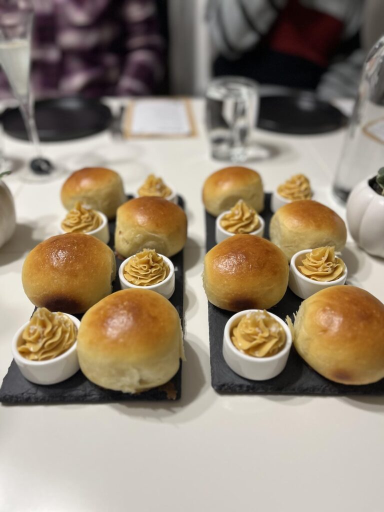 Small supper club: bread and butter, cucumber salad, roasted garlic hummus, lemon thyme sorbet, steak and pomme pave, lemon panna cotta