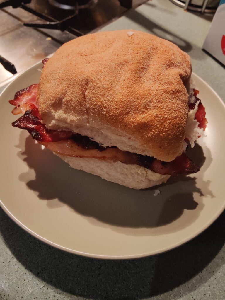 Bacon butty with butter and brown sauce