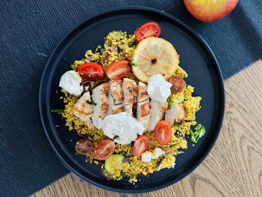 Lemony ras el hanout couscous with garlic tahini chicken