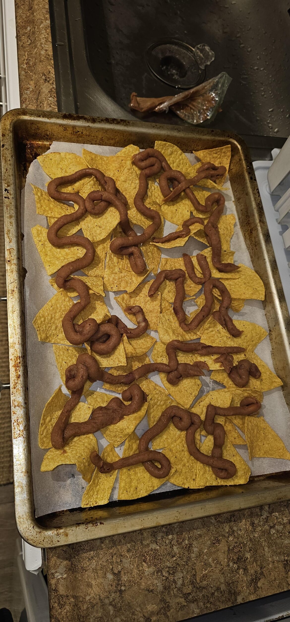 #FOODHACK Use a ziplock bag to pipe your refried beans onto the nachos for maximally equal distribution I guess