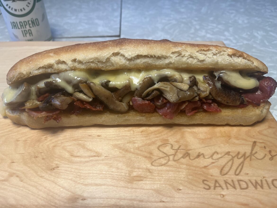 Melted Emmenthaler, sautéed oyster mushrooms and shiitakes, and grilled gabagool on a butter grilled baguette.