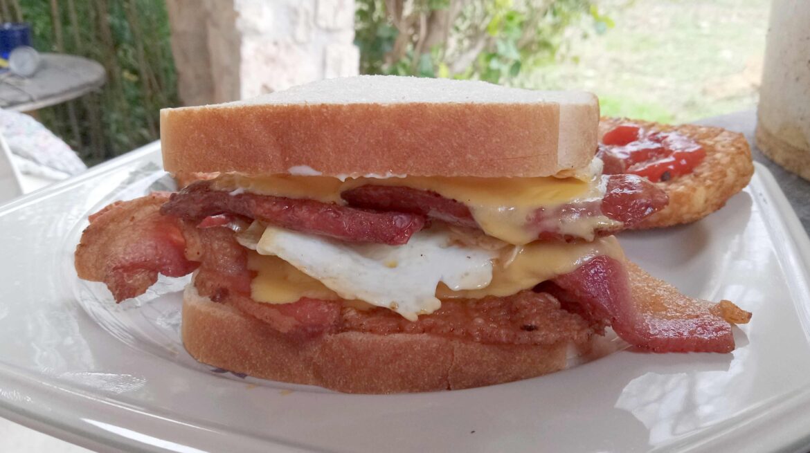 Haven't had breakfast yet? Here: Double egg (cooked over medium), double cheese, double bacon, and a single smoked sausage link. Double hash browns hiding in back.