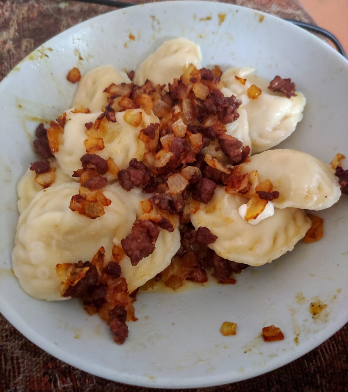 Ukrainian potato filled varenyky with fried onion and pork crackles. Best served with sour cream