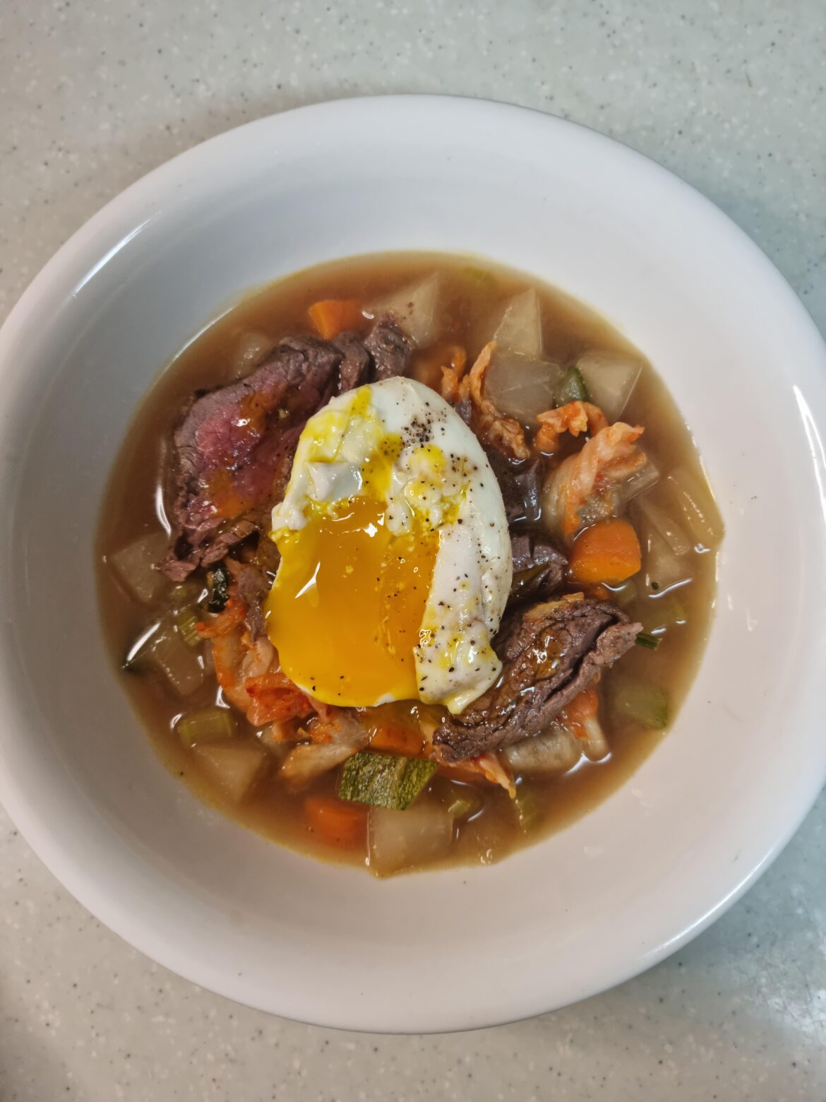 Got some soup with steak and egg