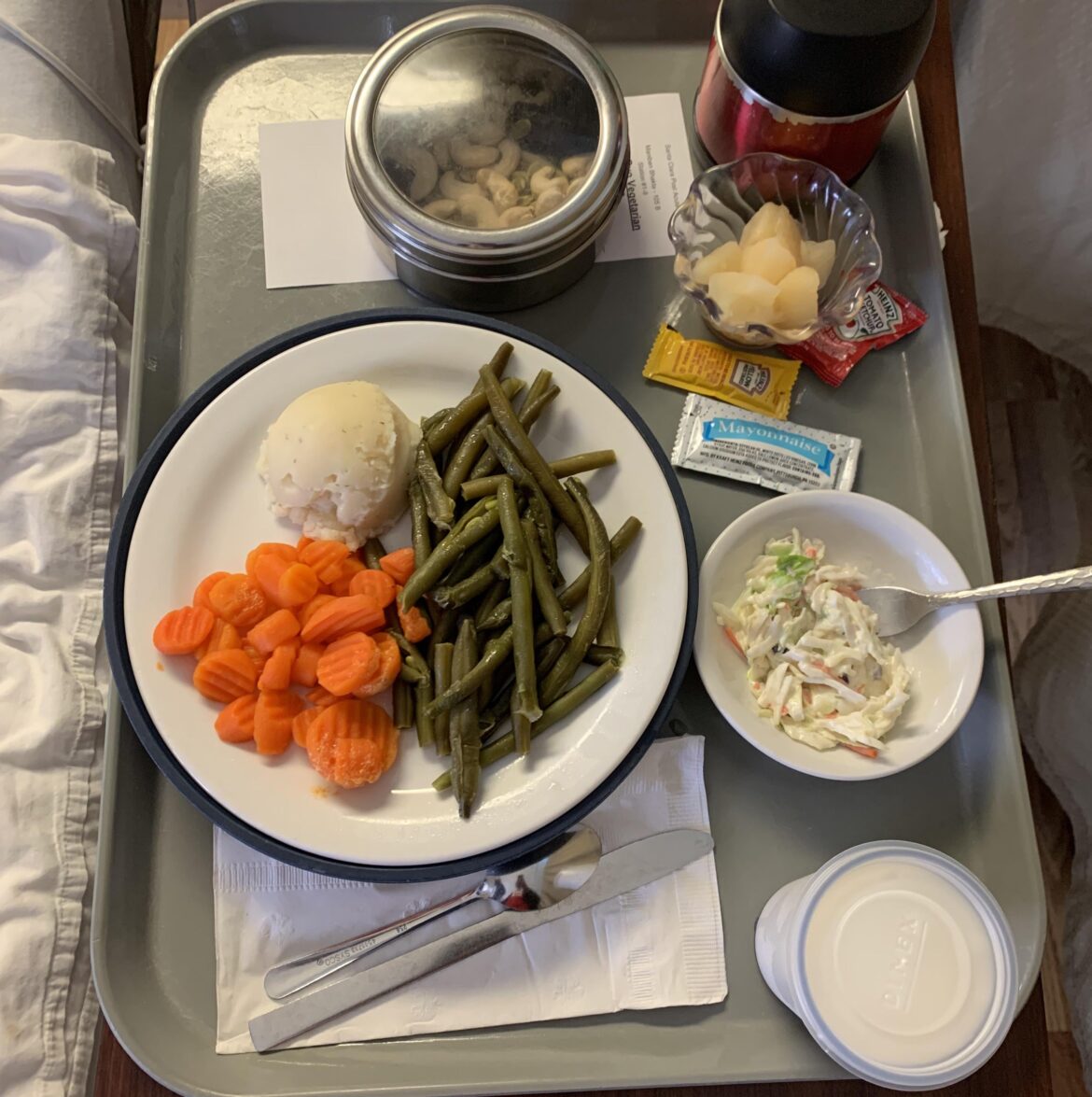 Grandma’s Vegetarian option at the hospital. Ketchup, Mustard, and Mayo for a little kick.