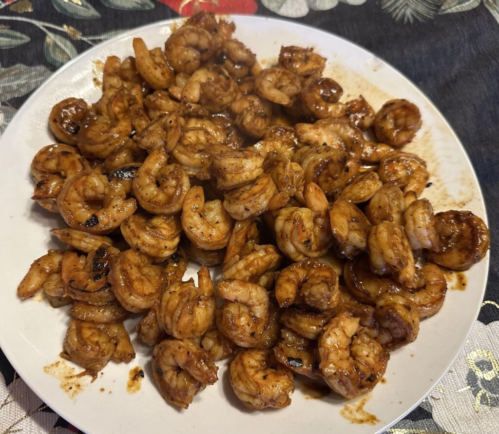 Chili Shrimp; tossed with powder made up of Habaneros, Yellow Ghosts, Chocolate Reapers, Scorpions, and Peach Ghosts.