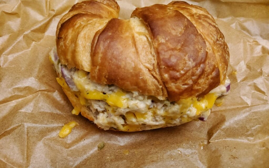 Who wants a warm mini croissant tuna melt with grated cheddar?