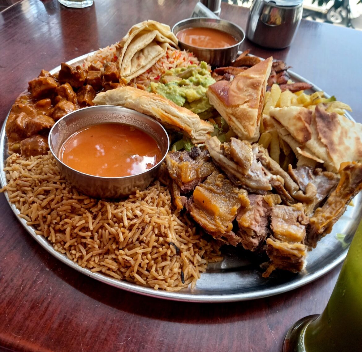 Somali Food: Pilau, Biryani, Camel Meat, Beef, Fries, Naan, Chapati, meat pie, Guacamole, Soup and Green juice.