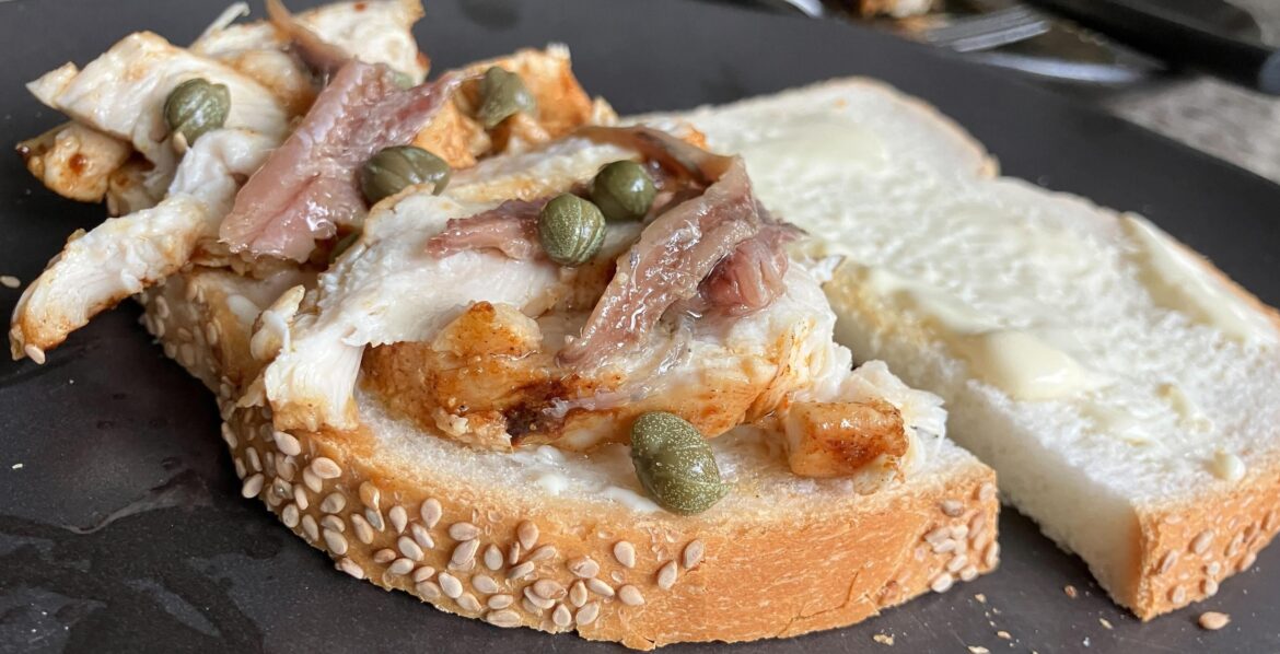 made me two of these earlier. chicken baked in butter and olive oil with anchovy, capers, cheese.