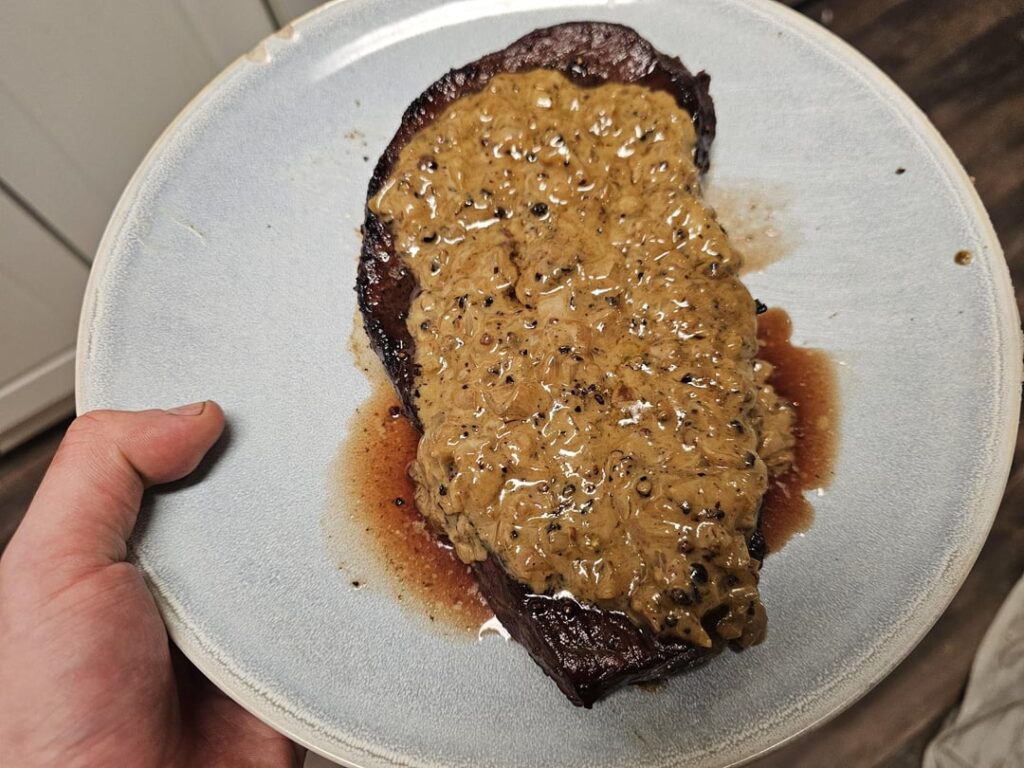 Steak au poivre. Though a bastardized version, as I used sirloin instead of filet mignon. What am I, made of money?