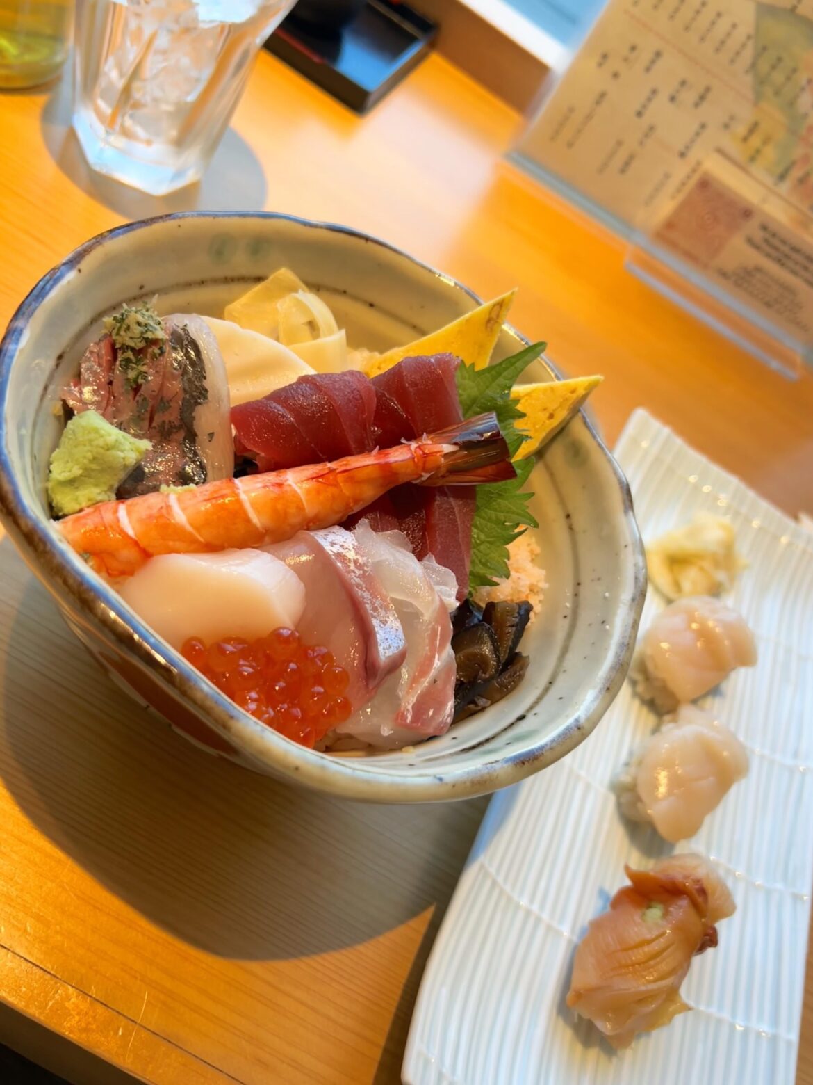 Awesome chirashi bowl I got from the airport in Japan during our short layover! Also got raw scallop sushi and arc shell sushi!