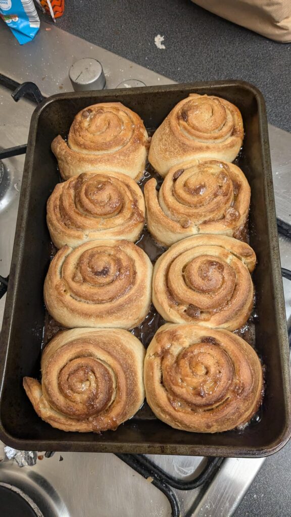 Sourdough cinnamon rolls with white chocolate chips and cream cheese frosting