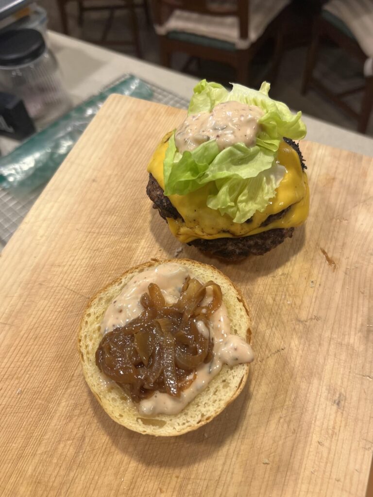 Burgers can never have too much caramelized onion sauce