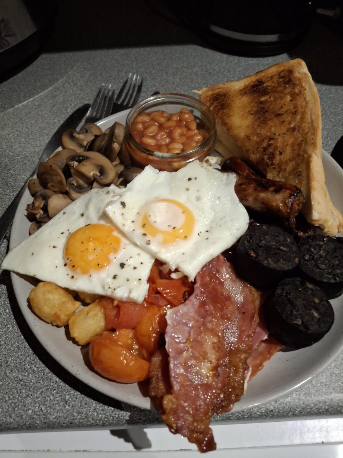 My full English, the sausages are under the egg, and I used hash brown bites