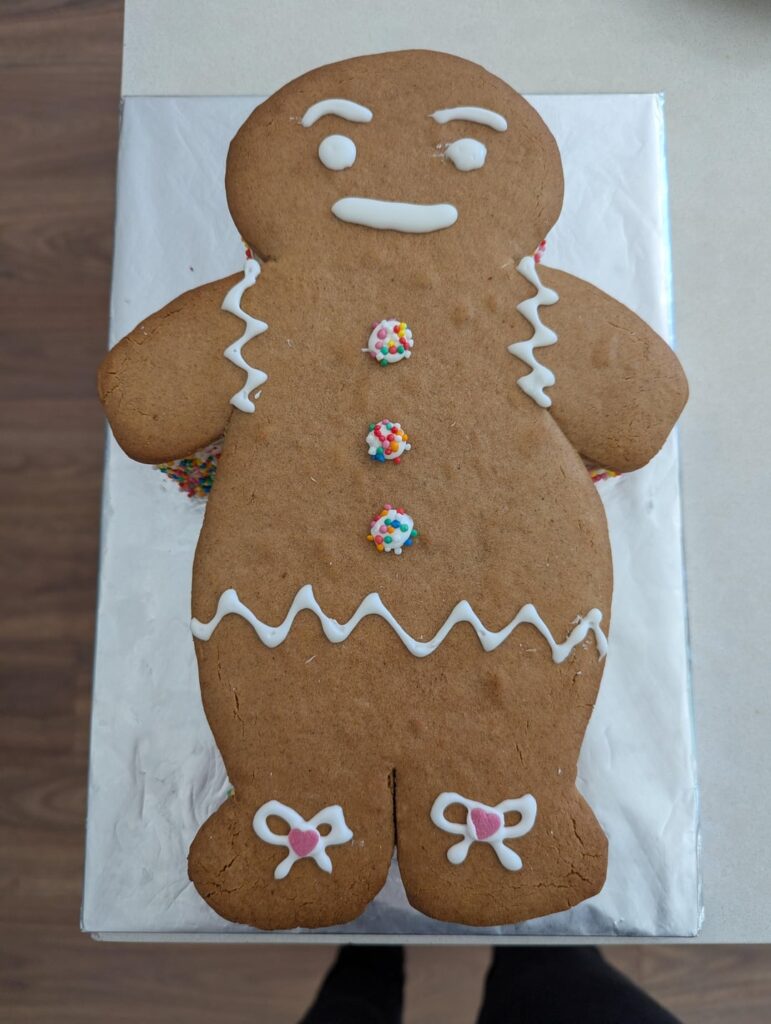 Child requested a gingerbread man cake for their birthday.