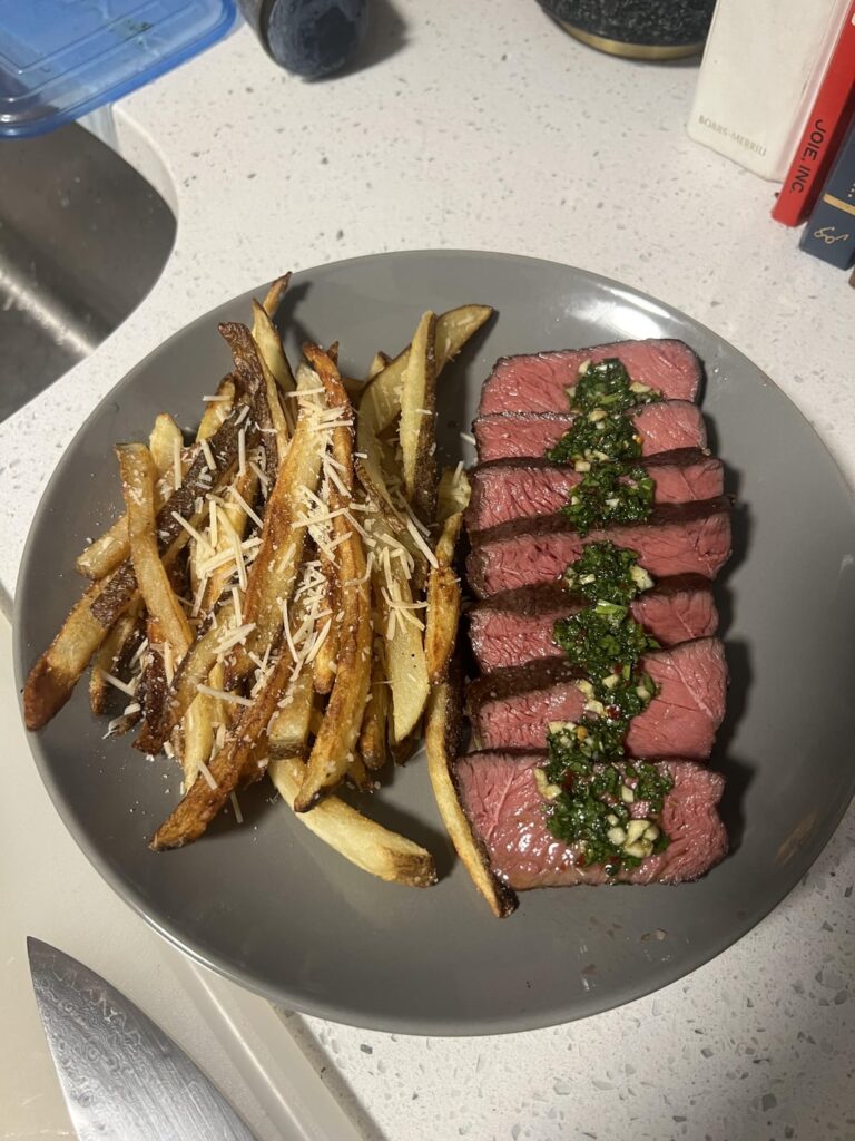 Steak with chimichurri and garlic parmesan fries