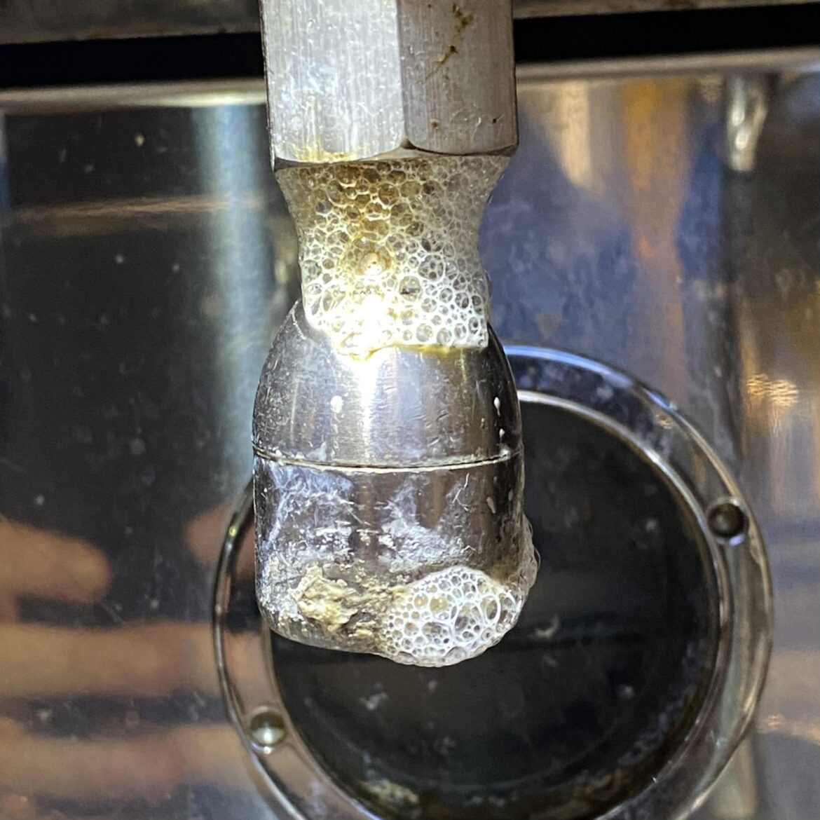 what is this crap all over the La Marzocco’s hot water tap and how do I clean it? what is this crap all over the La Marzocco's hot water tap and how do I clean it?