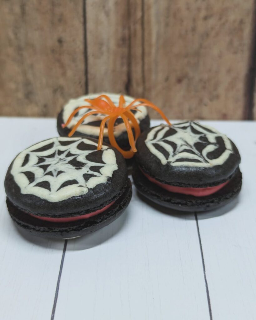 I forgot to post these! Chocolate spiderweb Halloween macarons