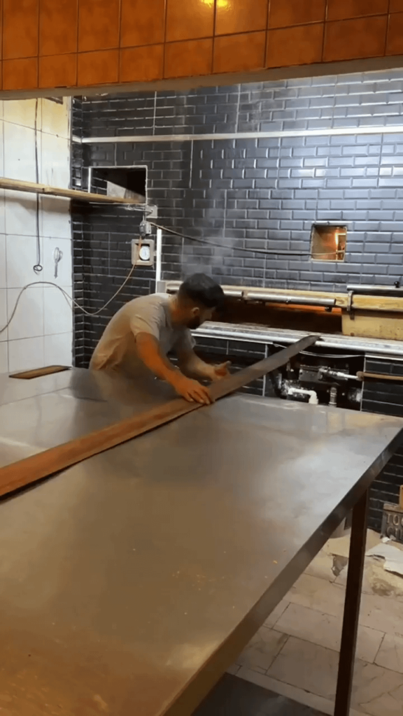 The lines of bread this man pulls out of the oven...