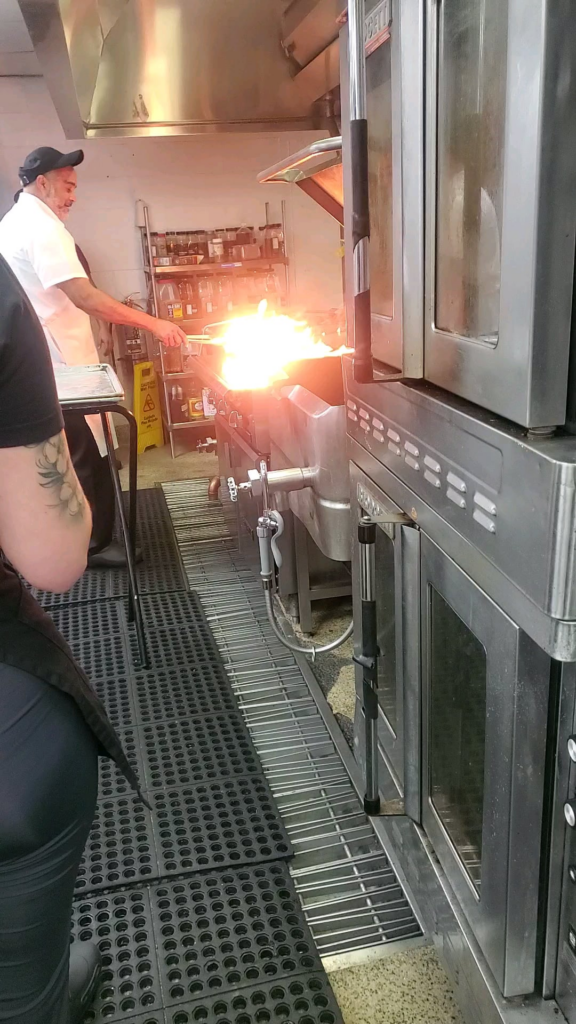 Someone left a sheet pan on the lit grill