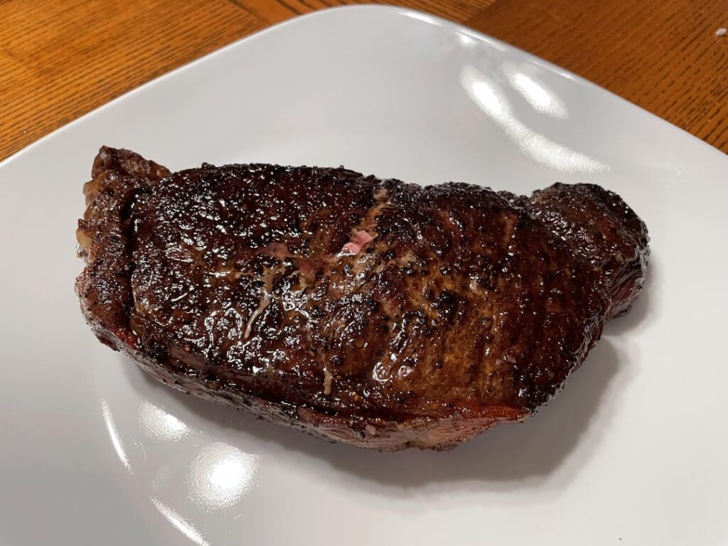 Tonight’s steak cooked outside in the dark under a flashlight.