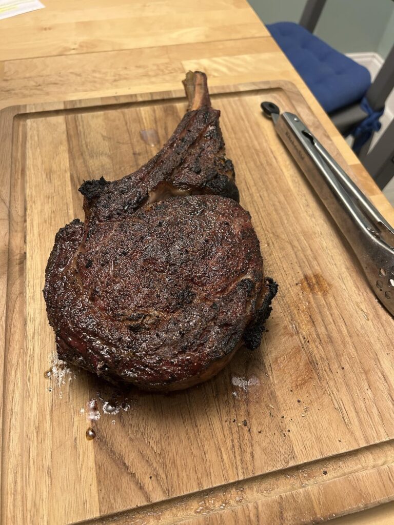 My Big Green Egg has ruined steak houses for me. Choice smoke reverse seared tomahawk from Sams (process in comments)
