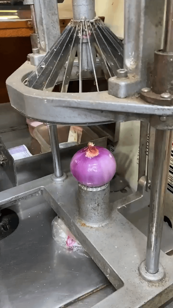 A blooming onion machine
