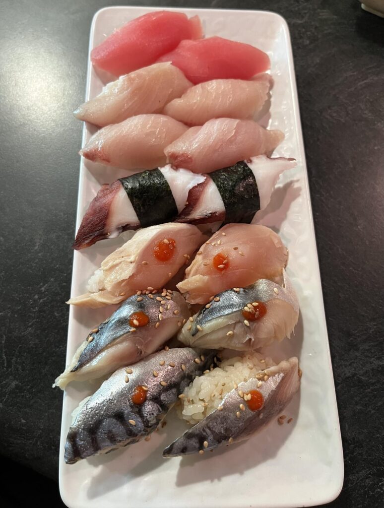 Eating nigiri at my favorite all you can eat sushi spot