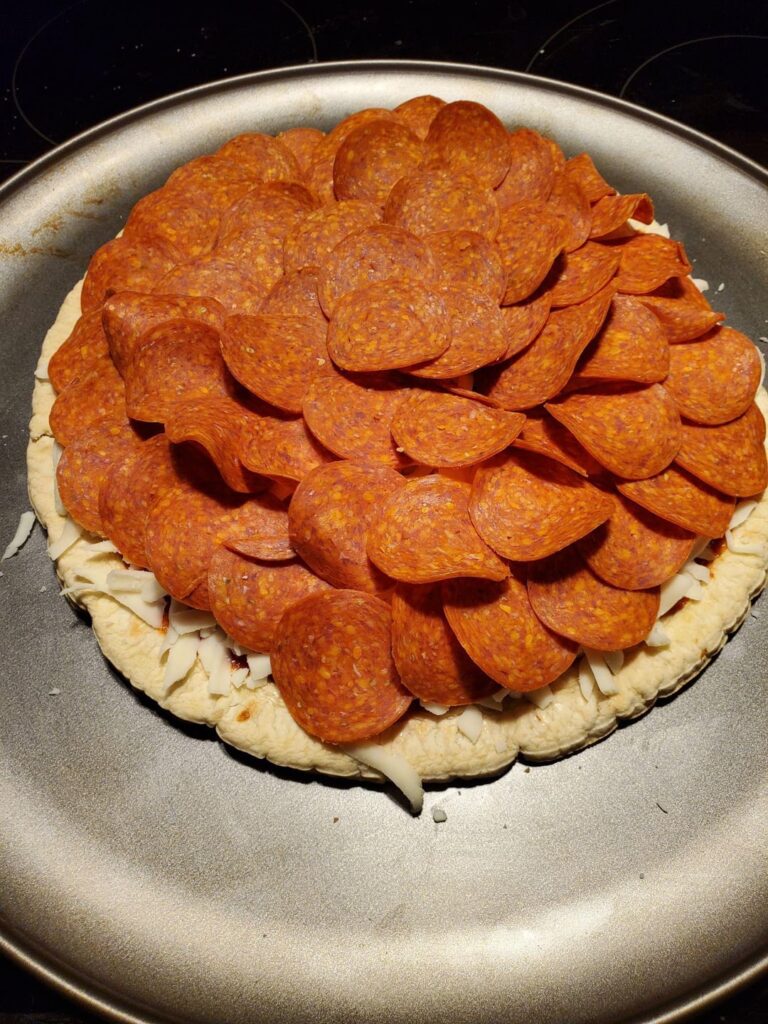 Bf scared me with the amount of pepperoni he put, but it looks a little better once it’s cooked