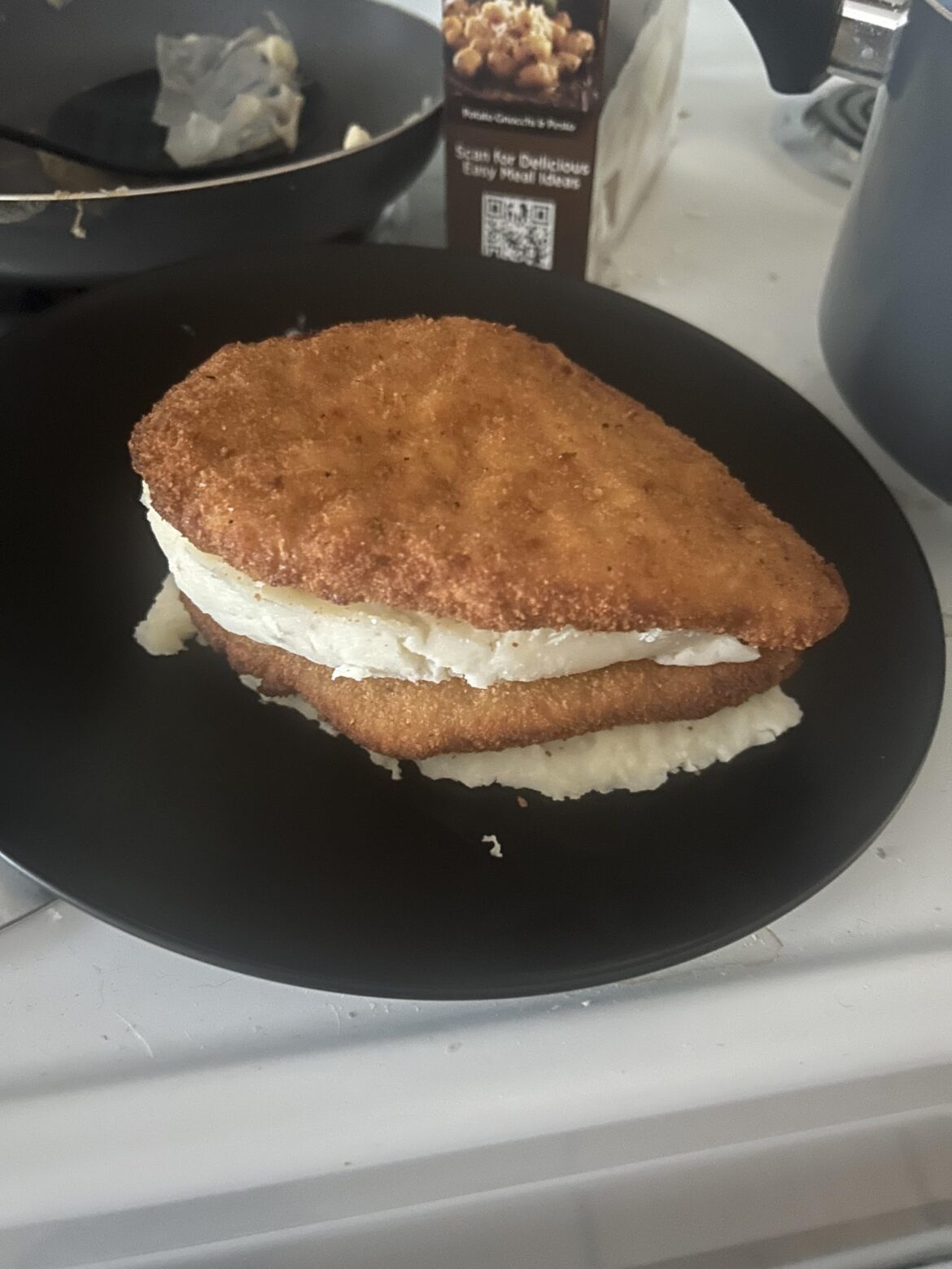My bachelor meal. Air fried chicken patty layer cake with Idahoan mashed potatoes. With salt and pepper of course.