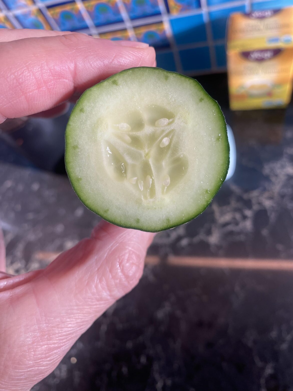 Never saw dark green dots around the perimeter of a cut cucumber