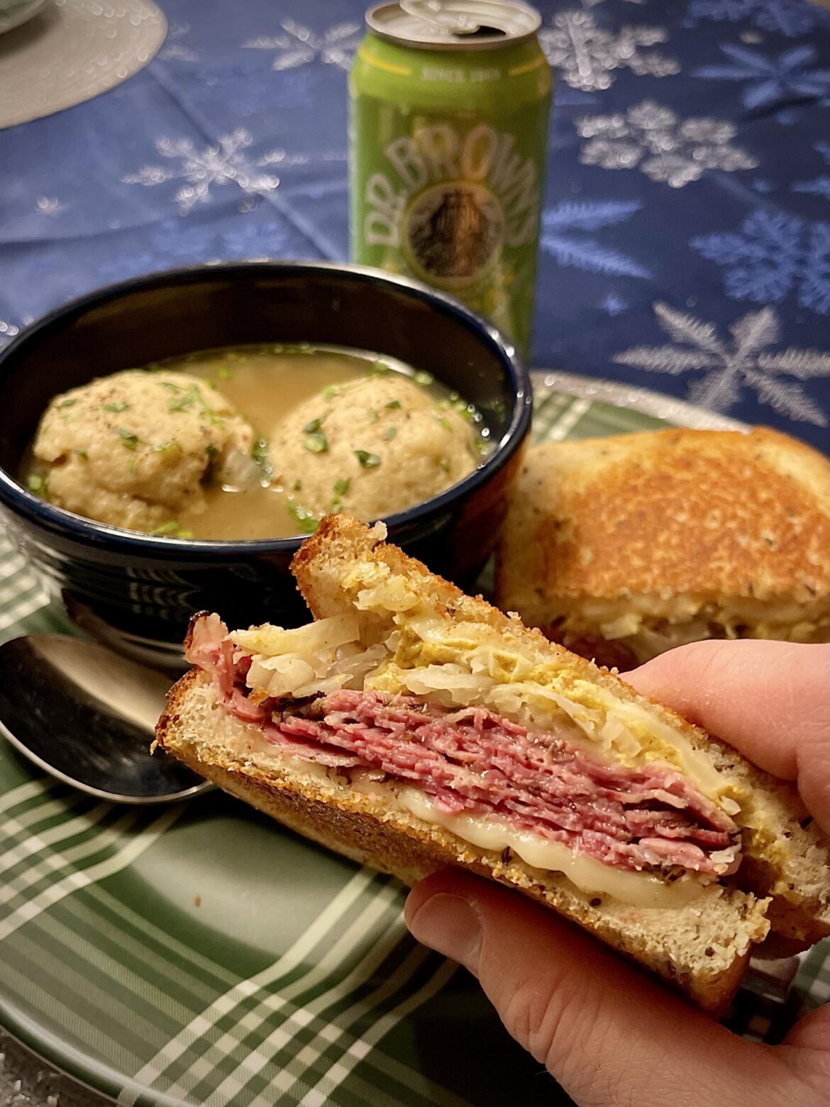 Homemade grilled pastrami on rye with matzo ball soup
