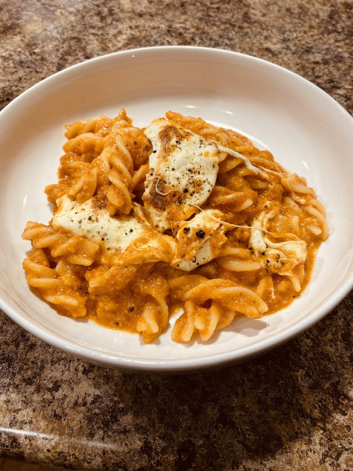 Fusilli in a homemade roasted tomato sauce and melted mozzarella Fusilli in a homemade roasted tomato sauce and melted mozzarella
