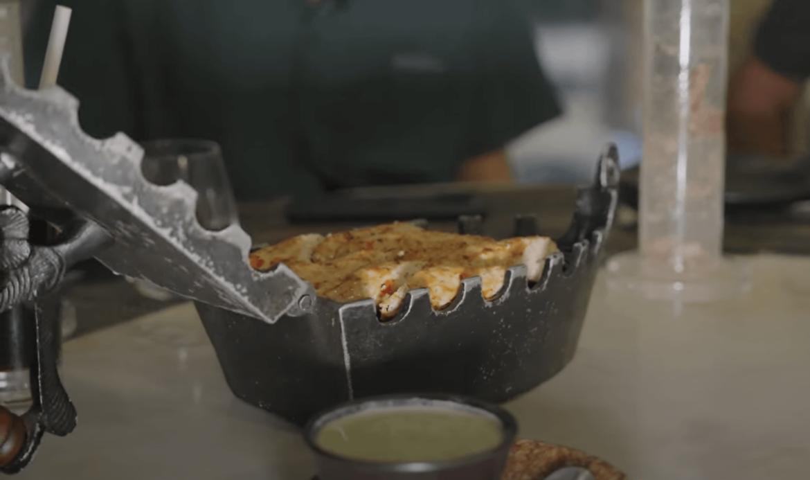 Youtubers served their meal in an old clothing iron