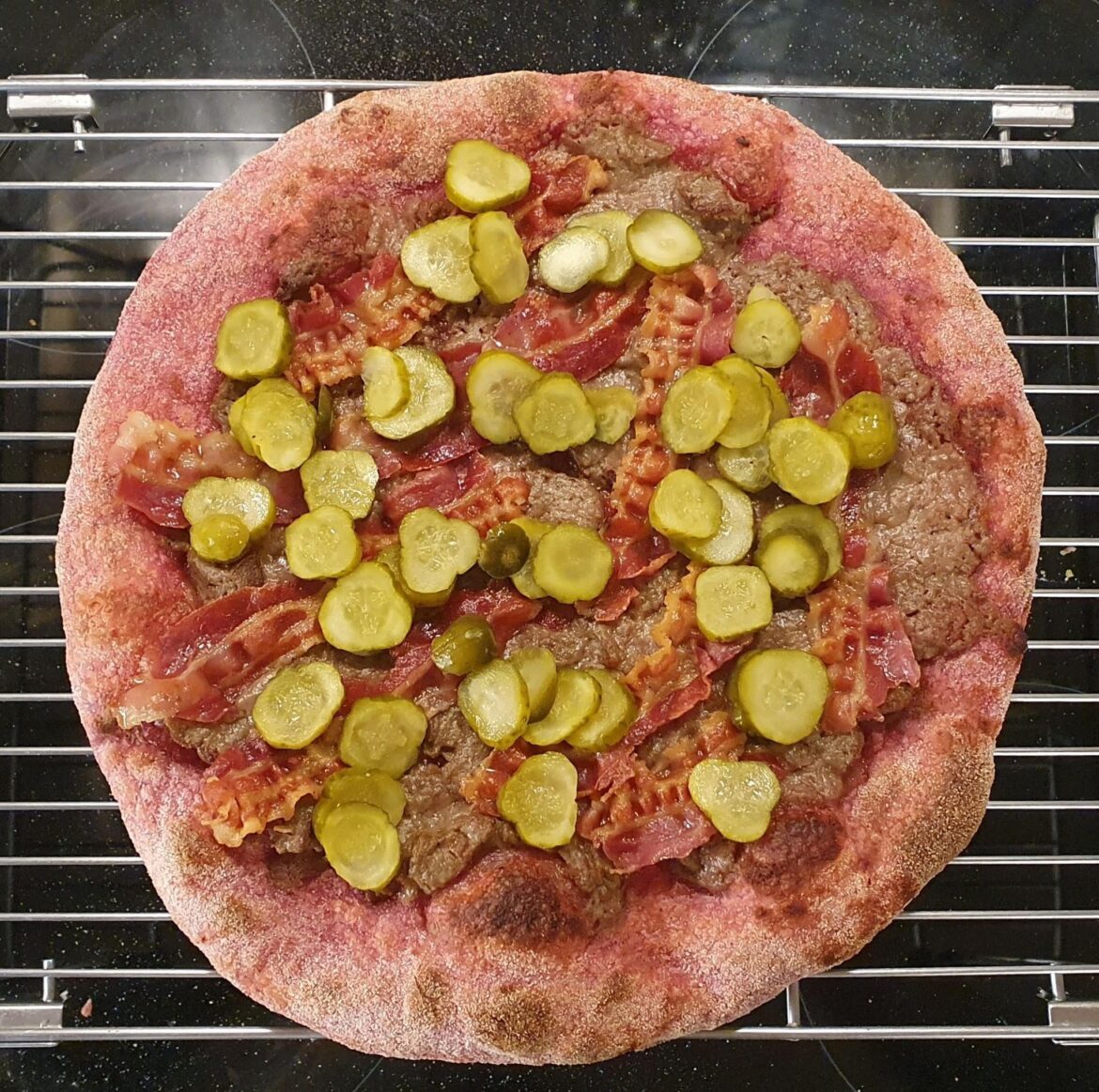 Spotted on a Pizza facebook group: beetroot in the dough, Liver pâté, bacon and thin slices of pickled cucumbers