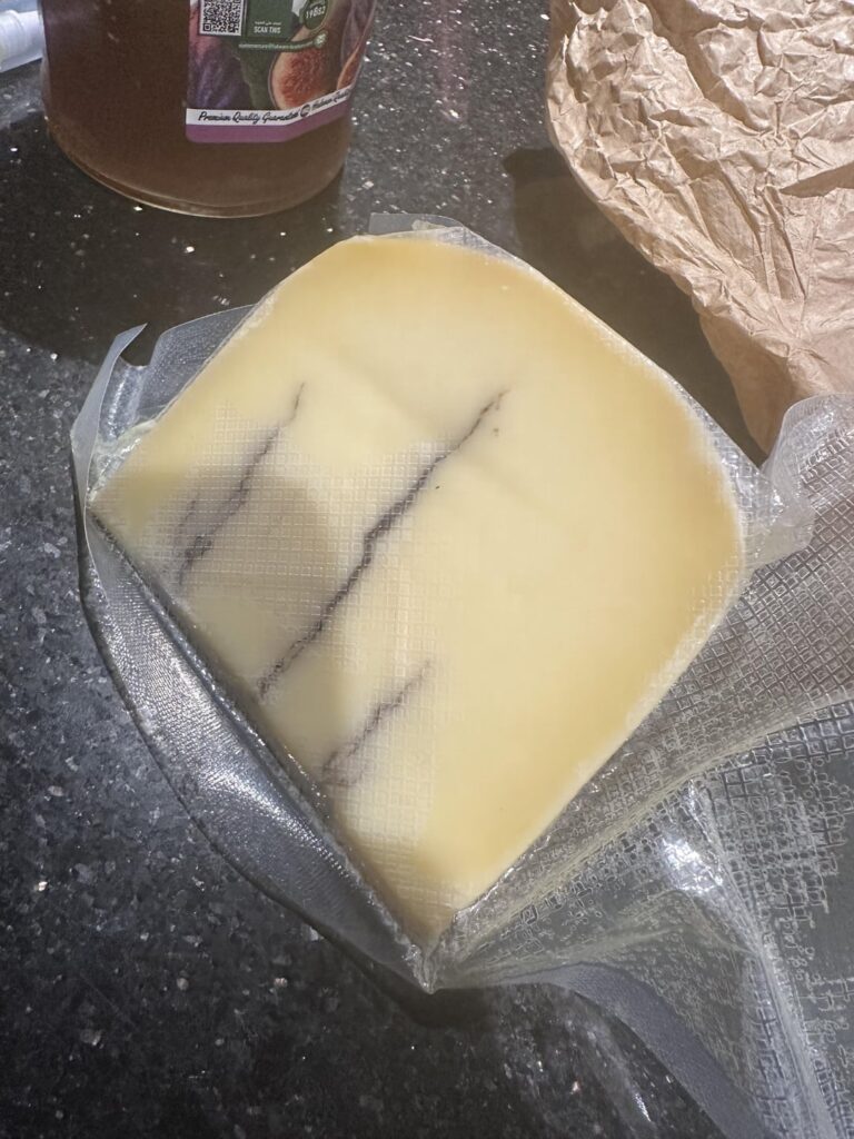Can you identify this cheese I got as a gift from Prague? And what should I pair it with?
