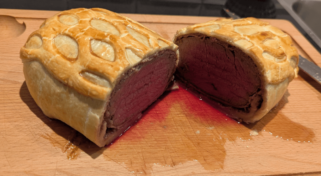Beef Wellington, roasted asparagus and brussel sprouts, & a red wine sauce