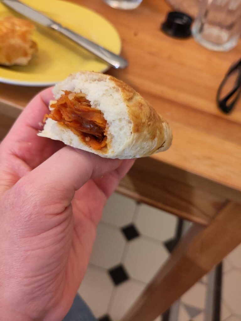 Baked Pyrizhky with cabbage filling (пиріжки з капустою, also known as "pirozhki" or "perieschkje")